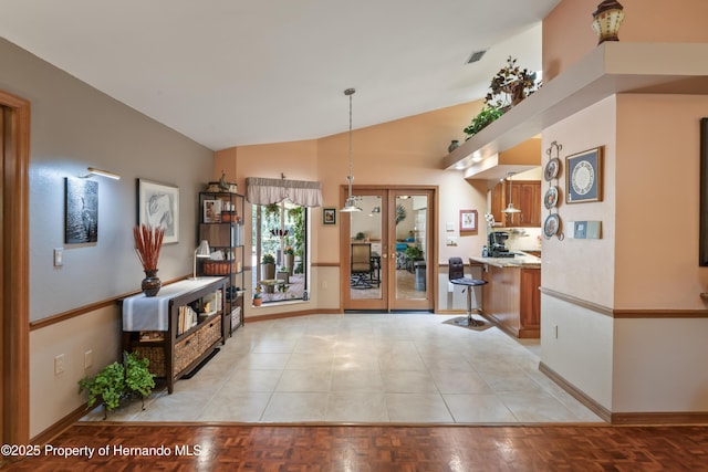 7353 Dogwood, Spring Hill, FL 34607 - entrance foyer with visible vents, baseboards, and lofted ceiling