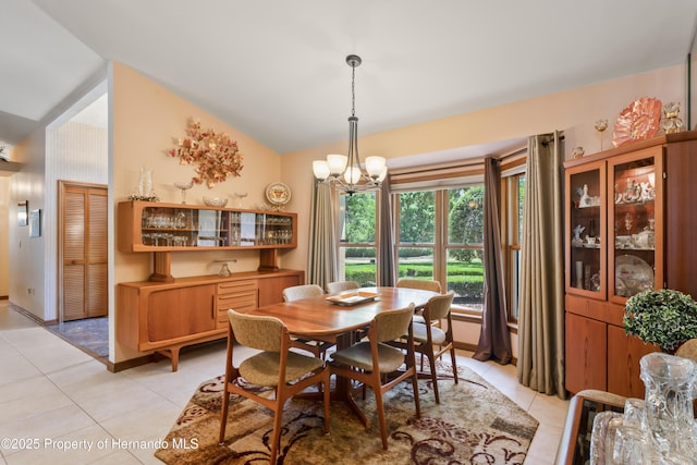 7353 Dogwood, Spring Hill, FL 34607 - dining area featuring light tile patterned floors, a notable chandelier, and lofted ceiling