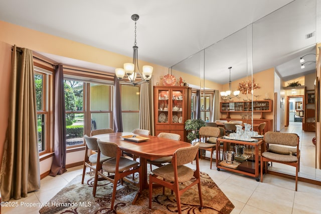 7353 Dogwood, Spring Hill, FL 34607 - dining space with an inviting chandelier, lofted ceiling, light tile patterned floors, and visible vents