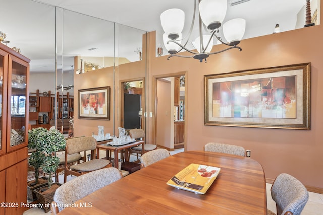 7353 Dogwood, Spring Hill, FL 34607 - dining area featuring baseboards and a notable chandelier