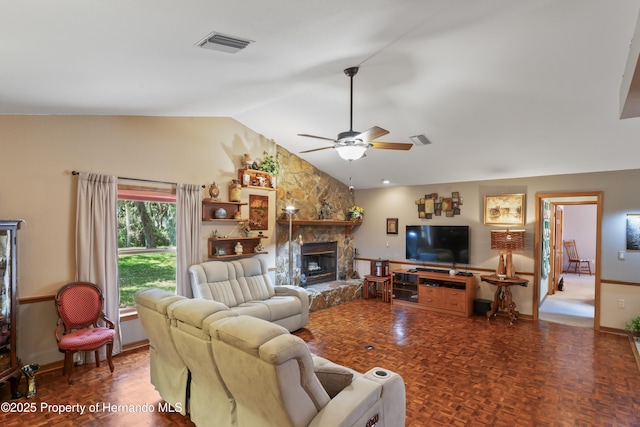 7353 Dogwood, Spring Hill, FL 34607 - living room featuring a fireplace, visible vents, baseboards, ceiling fan, and lofted ceiling