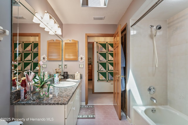 7353 Dogwood, Spring Hill, FL 34607 - bathroom featuring tile patterned flooring, visible vents, vanity, and tub / shower combination