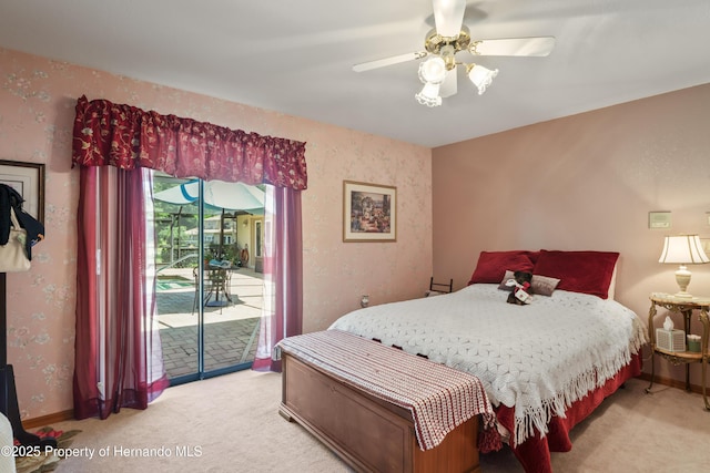 7353 Dogwood, Spring Hill, FL 34607 - bedroom with baseboards, access to outside, a ceiling fan, and light colored carpet