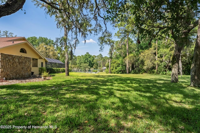 7353 Dogwood, Spring Hill, FL 34607 - view of yard with a lanai