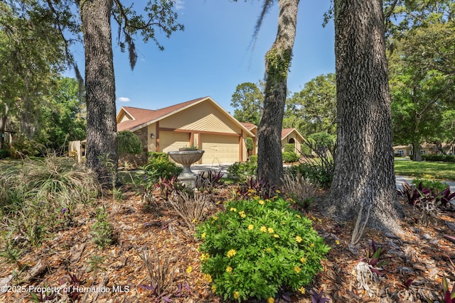 7353 Dogwood, Spring Hill, FL 34607 - view of property exterior with a garage