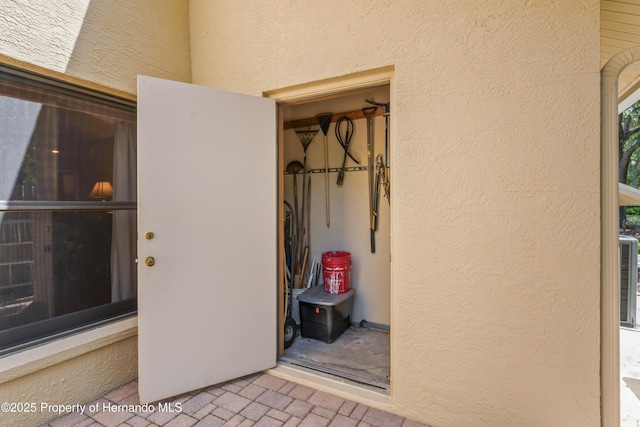 7353 Dogwood, Spring Hill, FL 34607 - doorway to property featuring stucco siding