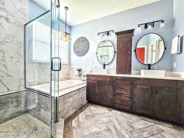 4214 Canongate Ct, Spring Hill, FL 34609 - full bath featuring a bath, double vanity, a shower stall, and a textured ceiling