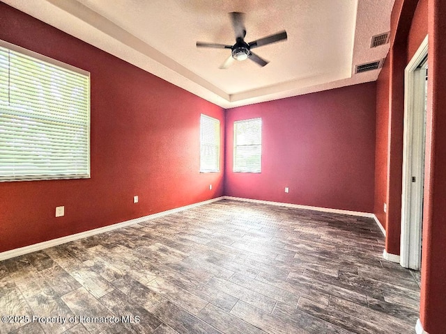 4214 Canongate Ct, Spring Hill, FL 34609 - spare room with a raised ceiling, ceiling fan, and wood finished floors
