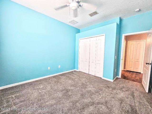4214 Canongate Ct, Spring Hill, FL 34609 - unfurnished bedroom featuring carpet floors, a closet, and a ceiling fan