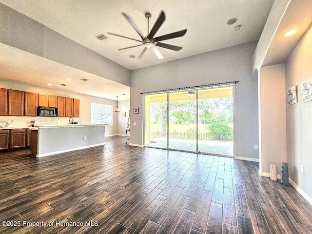 4214 Canongate Ct, Spring Hill, FL 34609 - unfurnished living room featuring ceiling fan, dark wood-style floors, and recessed lighting