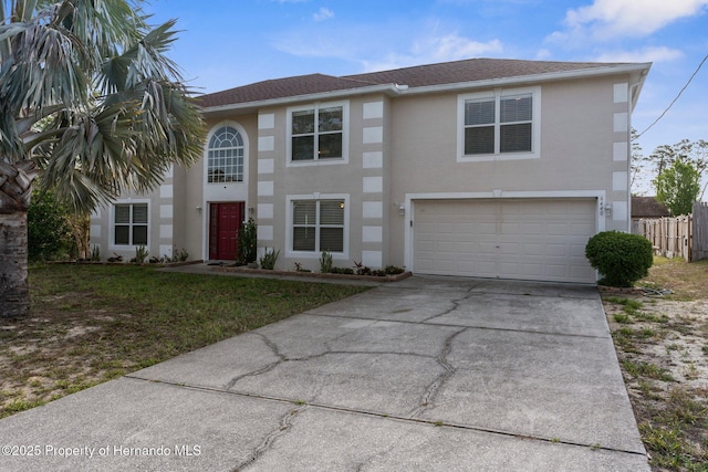 6440 Curtiss Ln, Spring Hill, FL 34608 - view of front of property with a garage, driveway, stucco siding, and a shingled roof