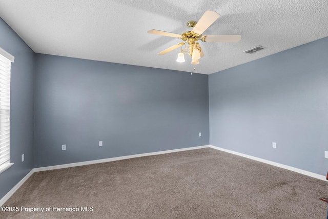 6440 Curtiss Ln, Spring Hill, FL 34608 - carpeted spare room with a textured ceiling, a ceiling fan, and baseboards