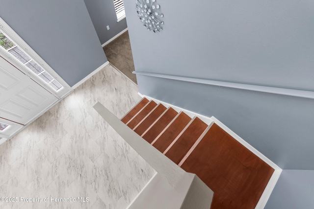 6440 Curtiss Ln, Spring Hill, FL 34608 - staircase featuring baseboards