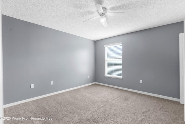 6440 Curtiss Ln, Spring Hill, FL 34608 - unfurnished room featuring a textured ceiling, ceiling fan, carpet floors, and baseboards