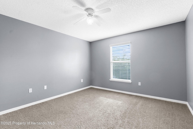 6440 Curtiss Ln, Spring Hill, FL 34608 - carpeted empty room with a ceiling fan, a textured ceiling, and baseboards