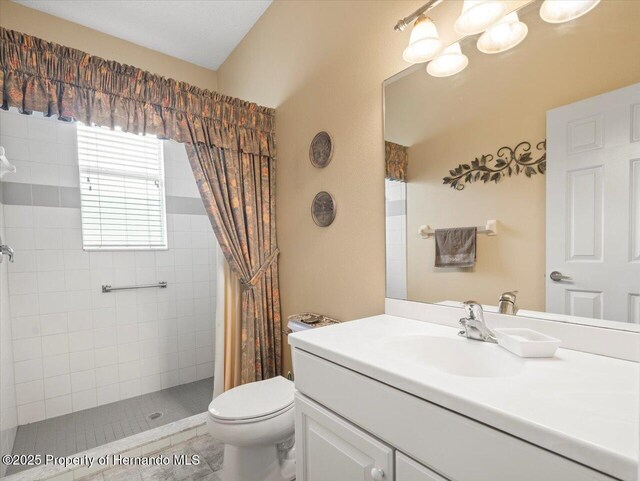 18514 Hidden Pines Way, Hudson, FL 34667 - full bath with tiled shower, vanity, and toilet