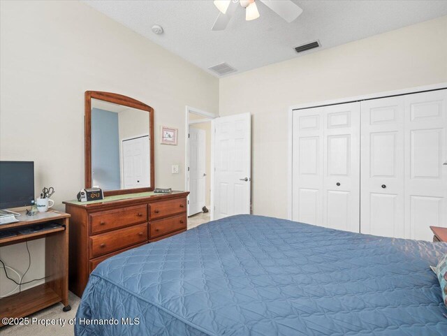 18514 Hidden Pines Way, Hudson, FL 34667 - bedroom featuring carpet, a ceiling fan, and a closet