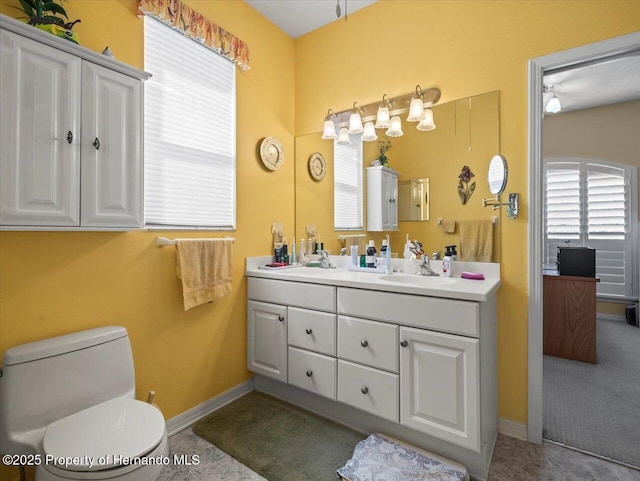 18514 Hidden Pines Way, Hudson, FL 34667 - bathroom featuring vanity, toilet, and baseboards