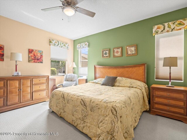 18514 Hidden Pines Way, Hudson, FL 34667 - bedroom featuring carpet floors and ceiling fan