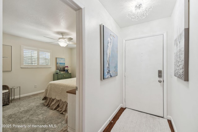 4008 Passport Ln, New Port Richey, FL 34653 - foyer featuring baseboards, a ceiling fan, and a textured ceiling