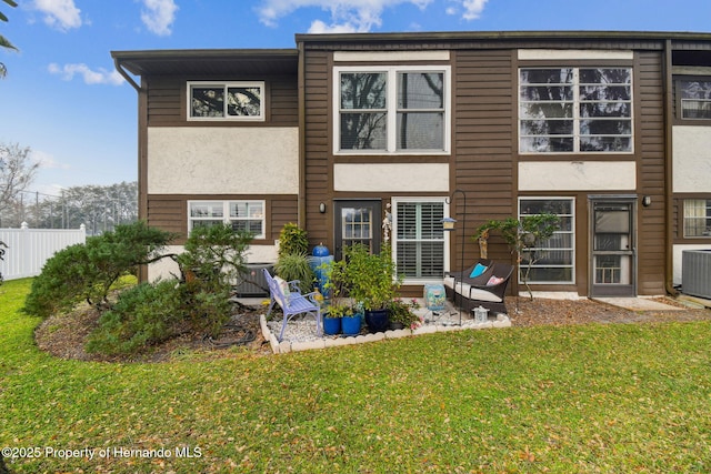 4008 Passport Ln, New Port Richey, FL 34653 - back of house with stucco siding and a patio