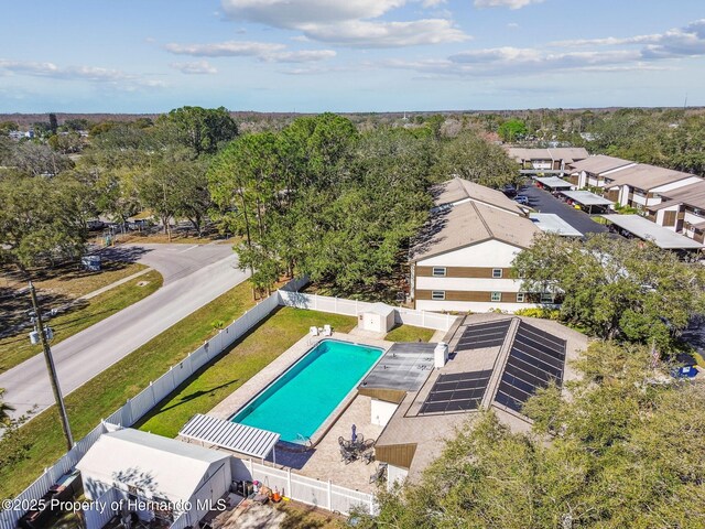4008 Passport Ln, New Port Richey, FL 34653 - bird's eye view of a pool and a tree filled landscape