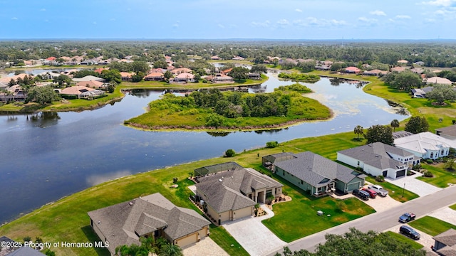 aerial perspective of suburban area featuring a large body of water