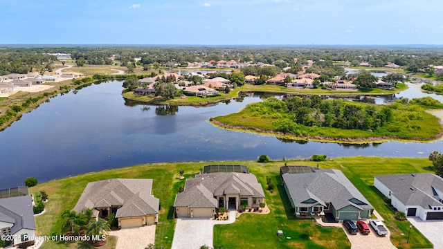 aerial view of residential area featuring a nearby body of water