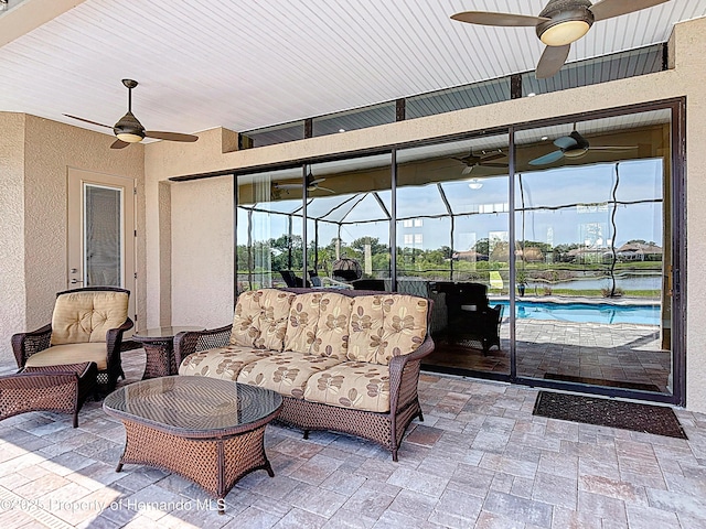 view of patio with ceiling fan, a lanai, an outdoor pool, and an outdoor living space