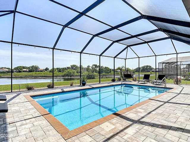 outdoor pool with a patio, a water view, and a lanai