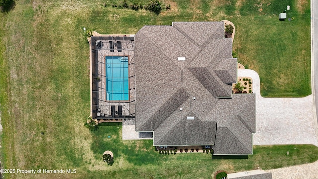 view of subject property with a pool