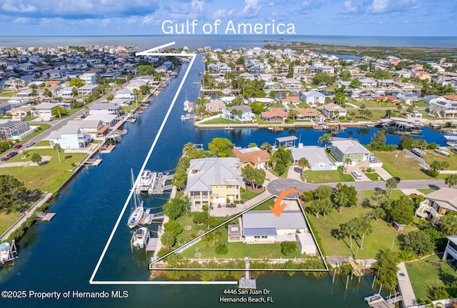 4446 San Juan Dr, Hernando Beach, FL 34607 - aerial perspective of suburban area with a large body of water