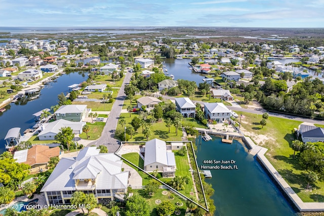 4446 San Juan Dr, Hernando Beach, FL 34607 - aerial perspective of suburban area with a nearby body of water