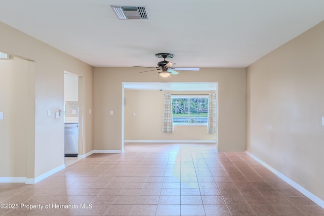 4446 San Juan Dr, Hernando Beach, FL 34607 - unfurnished room with ceiling fan, baseboards, and light tile patterned floors