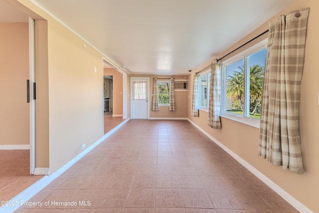 4446 San Juan Dr, Hernando Beach, FL 34607 - unfurnished sunroom with a wall mounted air conditioner