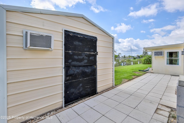 4446 San Juan Dr, Hernando Beach, FL 34607 - view of outdoor structure featuring an AC wall unit