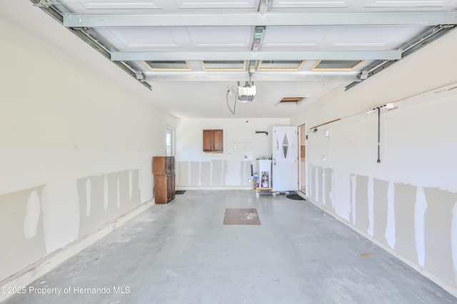 4446 San Juan Dr, Hernando Beach, FL 34607 - garage featuring a garage door opener