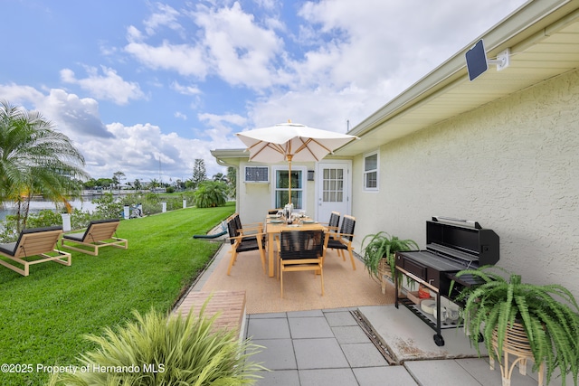 4446 San Juan Dr, Hernando Beach, FL 34607 - view of patio featuring outdoor dining area and a water view