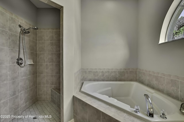 11336 Flower Ave, Weeki Wachee, FL 34613 - full bathroom featuring a garden tub and a tile shower