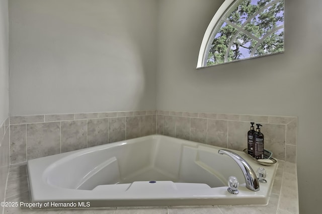 11336 Flower Ave, Weeki Wachee, FL 34613 - bathroom featuring a garden tub