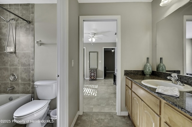 11336 Flower Ave, Weeki Wachee, FL 34613 - full bathroom with toilet, vanity, tile patterned floors, ceiling fan, and bathtub / shower combination