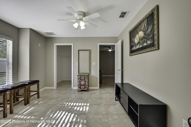 11336 Flower Ave, Weeki Wachee, FL 34613 - interior space featuring baseboards, ceiling fan, and visible vents