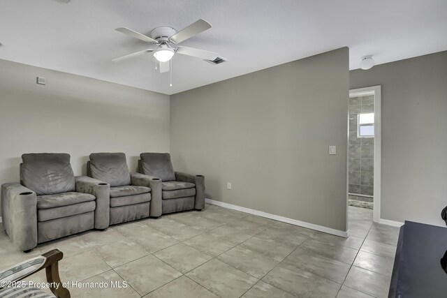11336 Flower Ave, Weeki Wachee, FL 34613 - interior space featuring light tile patterned floors, visible vents, baseboards, and ceiling fan