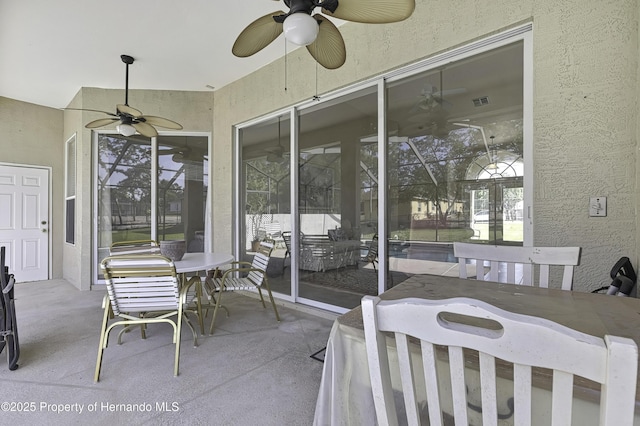 11336 Flower Ave, Weeki Wachee, FL 34613 - view of patio featuring ceiling fan and glass enclosure