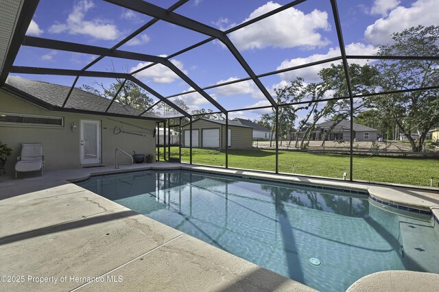 11336 Flower Ave, Weeki Wachee, FL 34613 - pool featuring a yard, a patio area, glass enclosure, and an outdoor structure