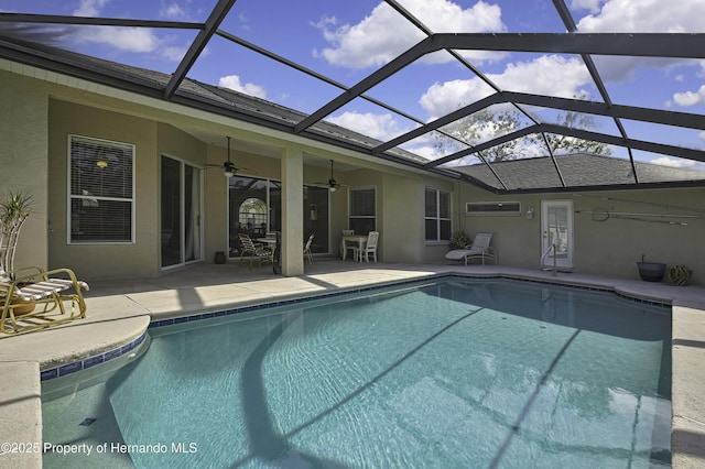 11336 Flower Ave, Weeki Wachee, FL 34613 - pool featuring a patio area, ceiling fan, and glass enclosure
