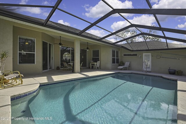 11336 Flower Ave, Weeki Wachee, FL 34613 - pool featuring a patio area, ceiling fan, and glass enclosure