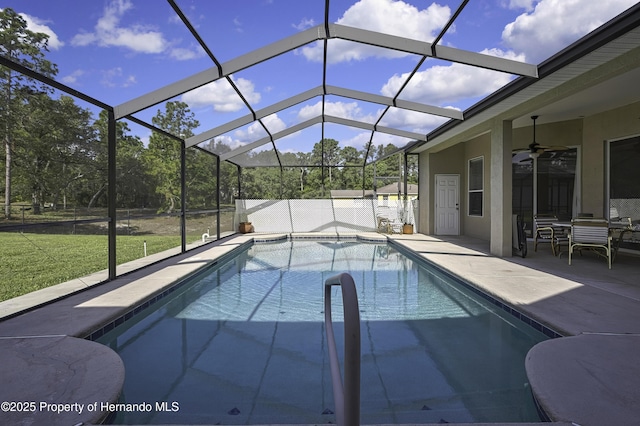 11336 Flower Ave, Weeki Wachee, FL 34613 - pool with ceiling fan, a patio area, a lanai, and a lawn