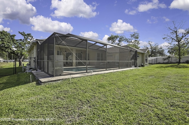 11336 Flower Ave, Weeki Wachee, FL 34613 - rear view of property with a yard, a fenced in pool, a fenced backyard, and a patio area