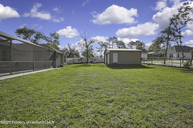11336 Flower Ave, Weeki Wachee, FL 34613 - view of yard with an outdoor structure, a storage unit, a fenced backyard, and glass enclosure